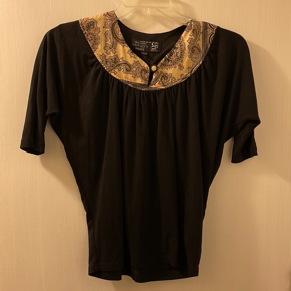 Black short sleeve shirt with paisley front.